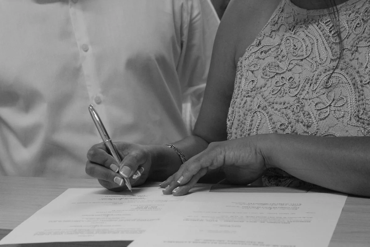 Applicant signing the MEPCO new connection application form